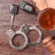 gavel key handcuffs whiskey top view 2026 03 09 04 35 56 utc 80x80