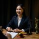 woman in suit smiling at wooden table 2026 03 25 22 41 12 utc 80x80